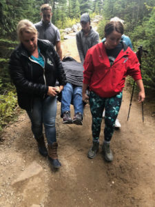 Stretcher rescue on a mountain trail